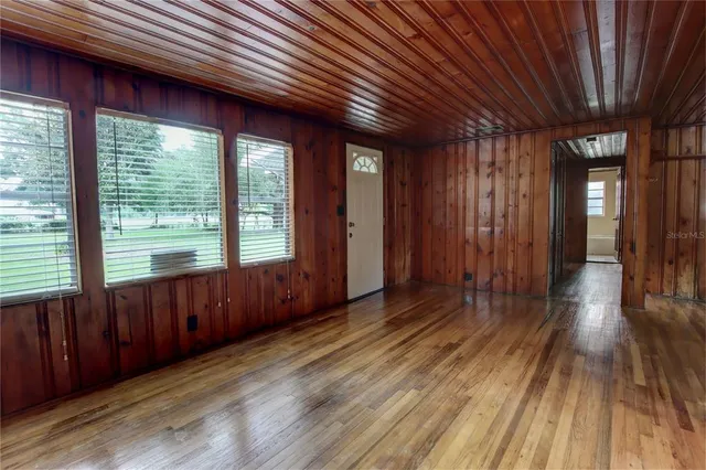a view of hallway with wooden floor