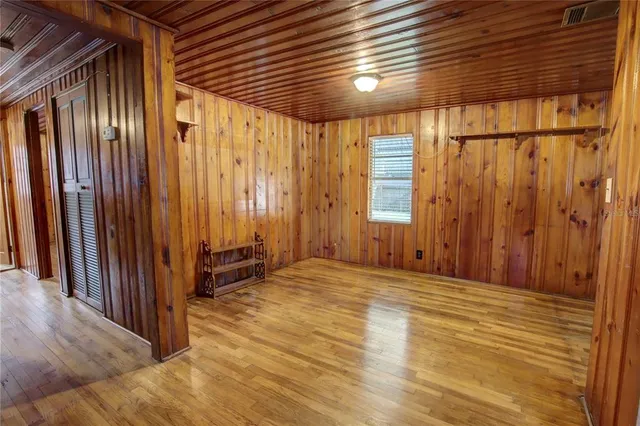 a view of a room with a balcony and stairs