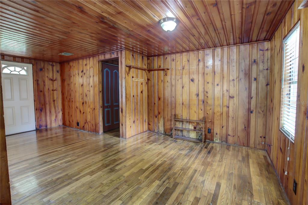 1870 Lake Markham Road Sanford, FL 32771 - Photo 13 of 23 a view of a room with wooden floor and a window