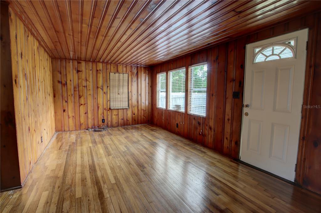 1870 Lake Markham Road Sanford, FL 32771 - Photo 8 of 23 a view of an empty room with wooden floor and a window