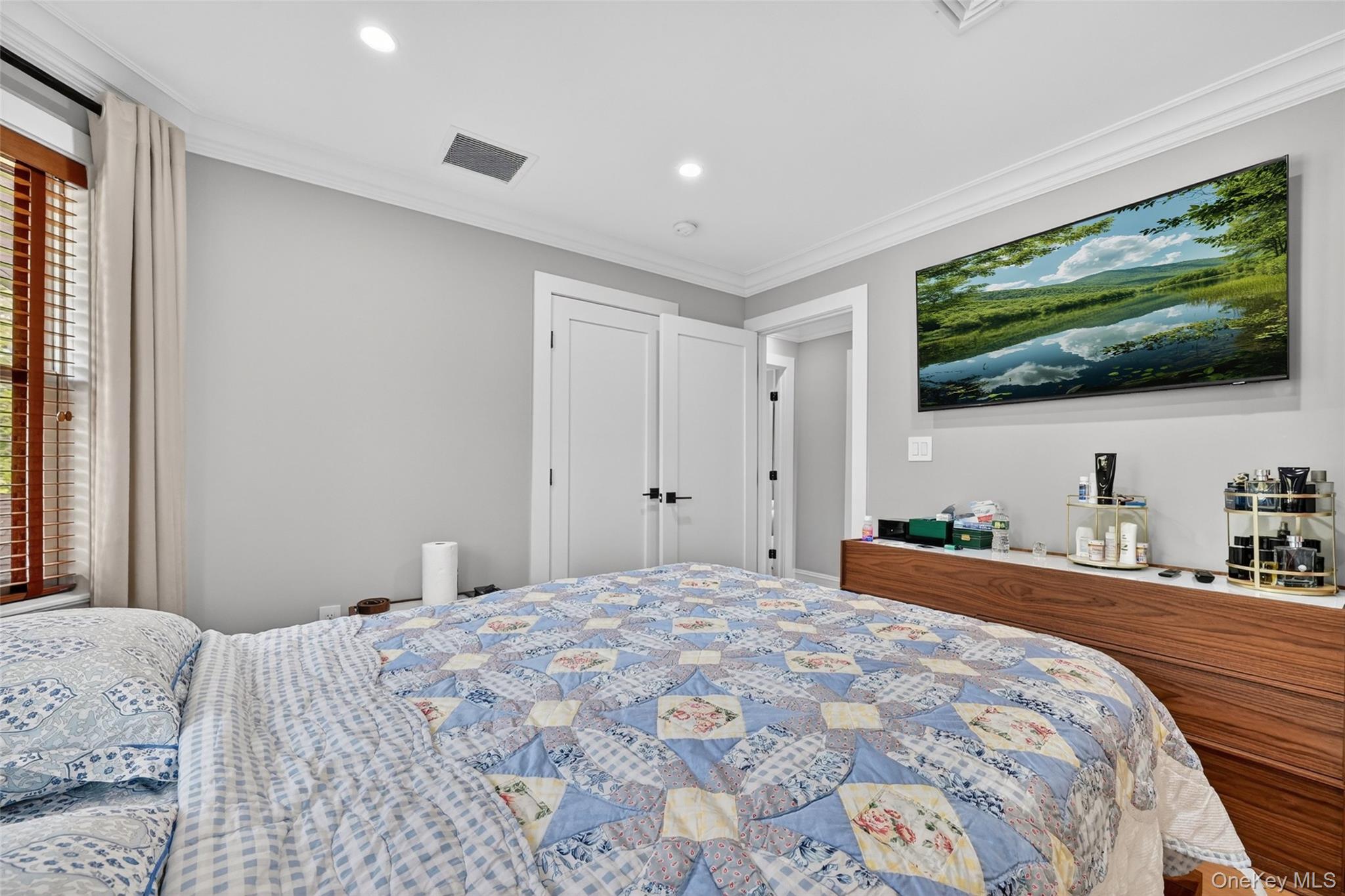 65 Wildway Bronxville, NY 10708 - Photo 29 of 42 Recessed lighting illuminates the space, featuring white crown molding and light gray wall paint