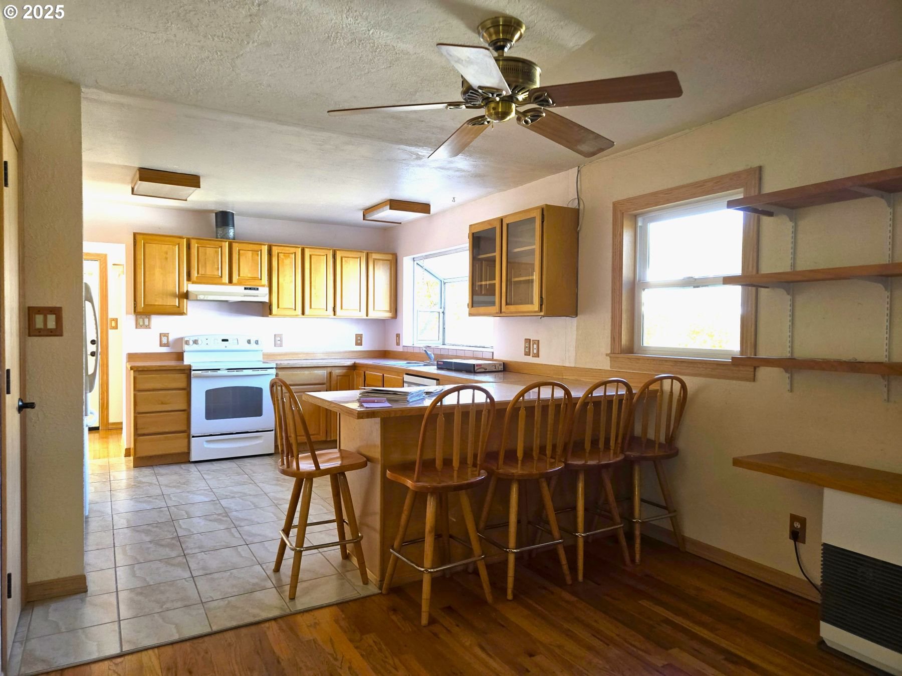 212 Northwest 5th Avenue John Day, OR 97845 - Photo 13 of 38 a kitchen with a table chairs sink and cabinets