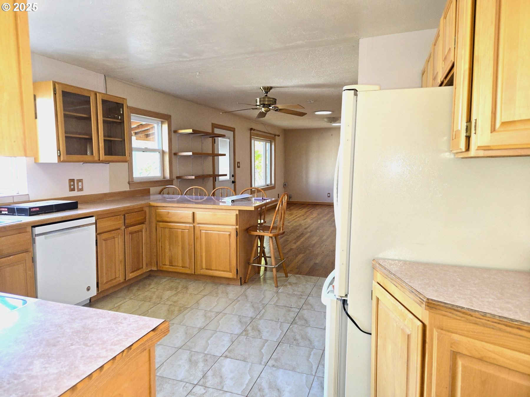 212 Northwest 5th Avenue John Day, OR 97845 - Photo 15 of 38 a kitchen with a sink a stove top oven and cabinetry