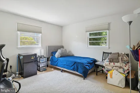 a bedroom with furniture and a window
