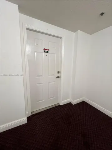 an empty room with wooden floor