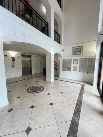 a view of a hallway with windows