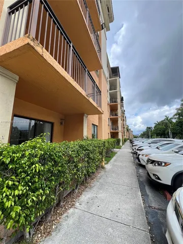 a view of a building with a yard