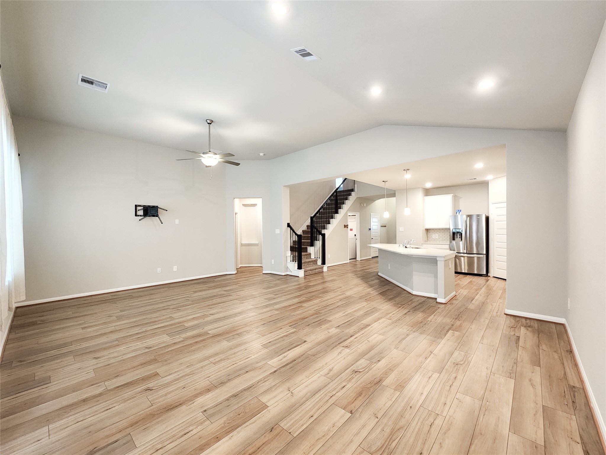 10714 Clfs Vw Drive Rosharon, TX 77583 - Photo 11 of 30 a view of a living room a wooden floor and a large window