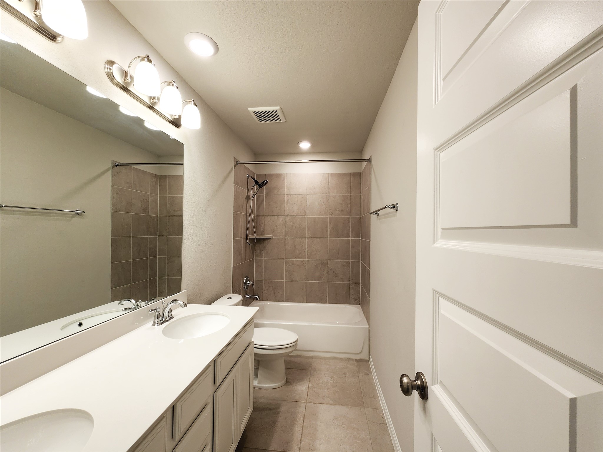 10714 Clfs Vw Drive Rosharon, TX 77583 - Photo 13 of 30 a bathroom with a sink a toilet a mirror and shower