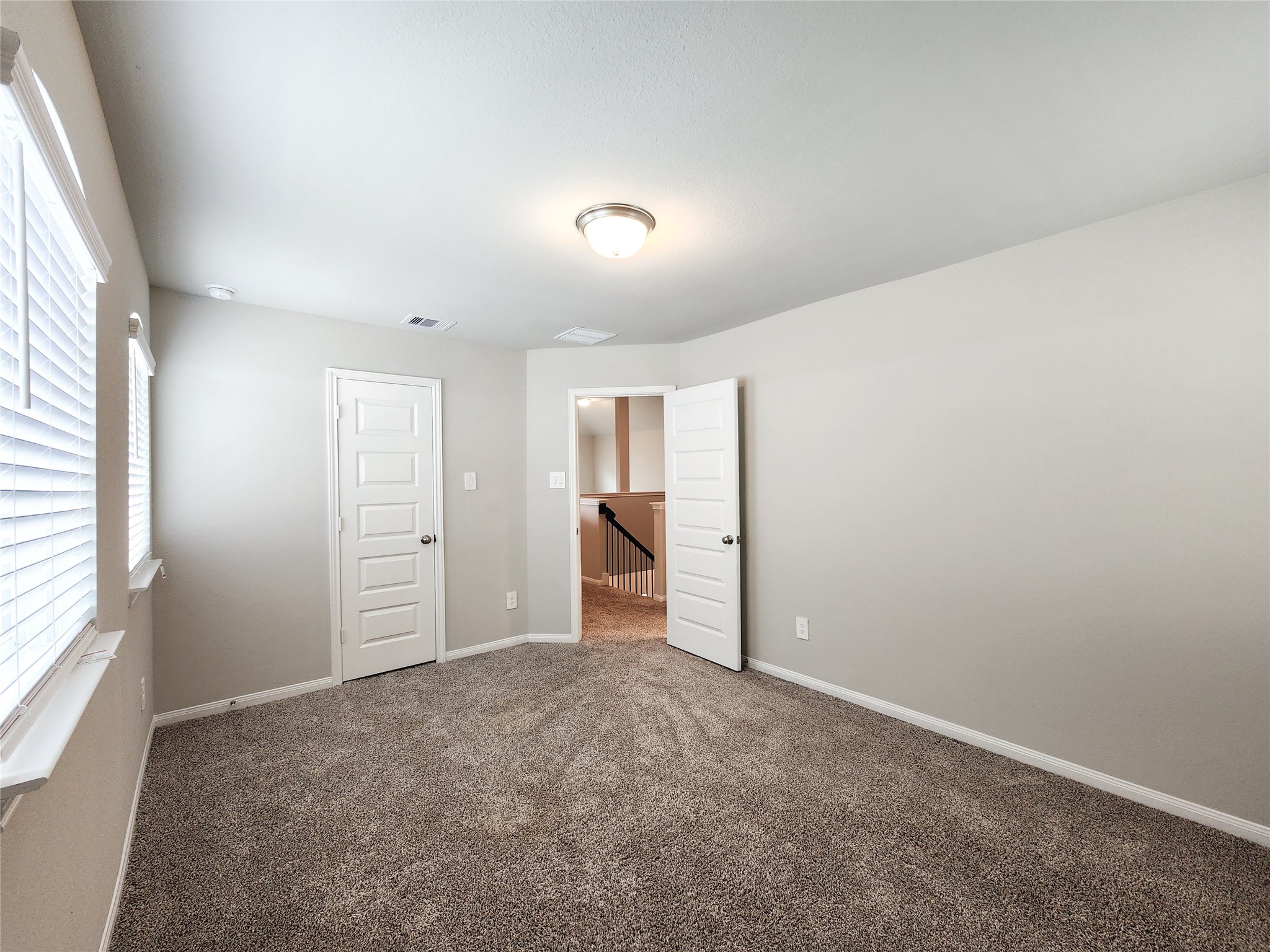 10714 Clfs Vw Drive Rosharon, TX 77583 - Photo 16 of 30 an empty room with closet and windows