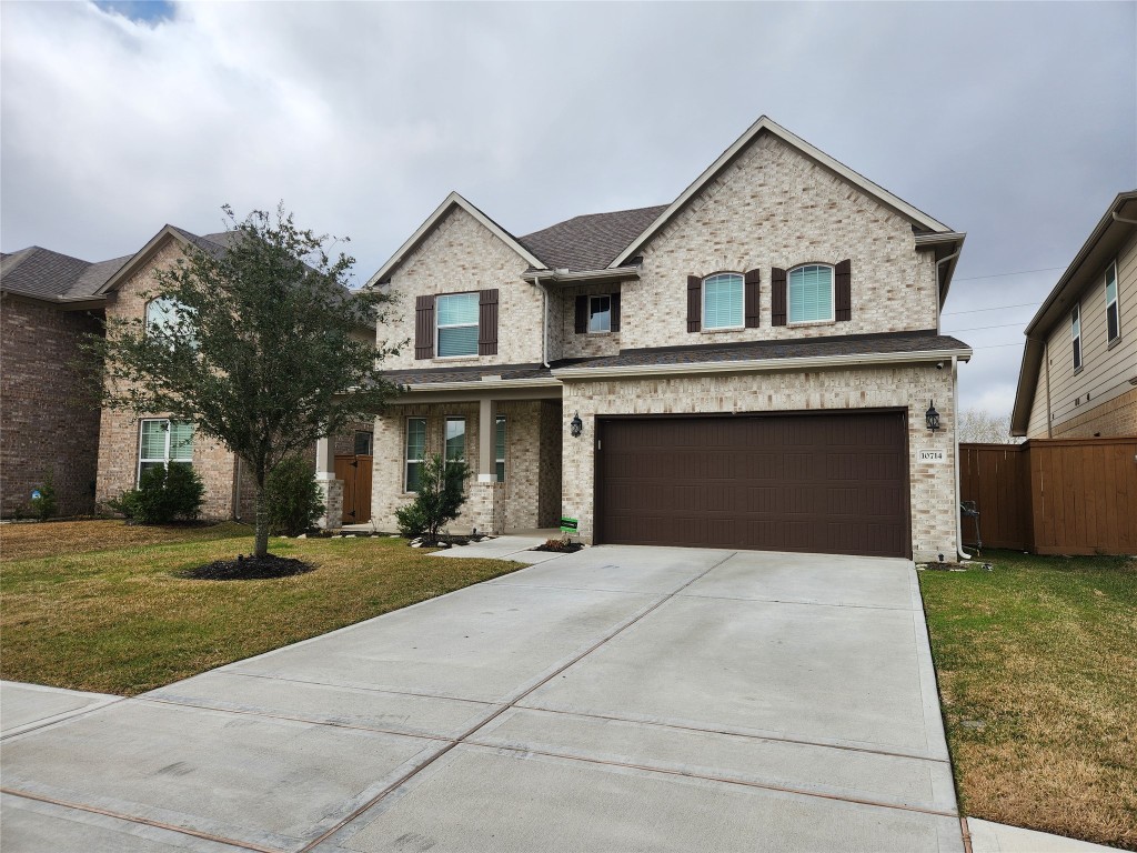 10714 Clfs Vw Drive Rosharon, TX 77583 - Photo 2 of 30 a front view of a house with yard and parking