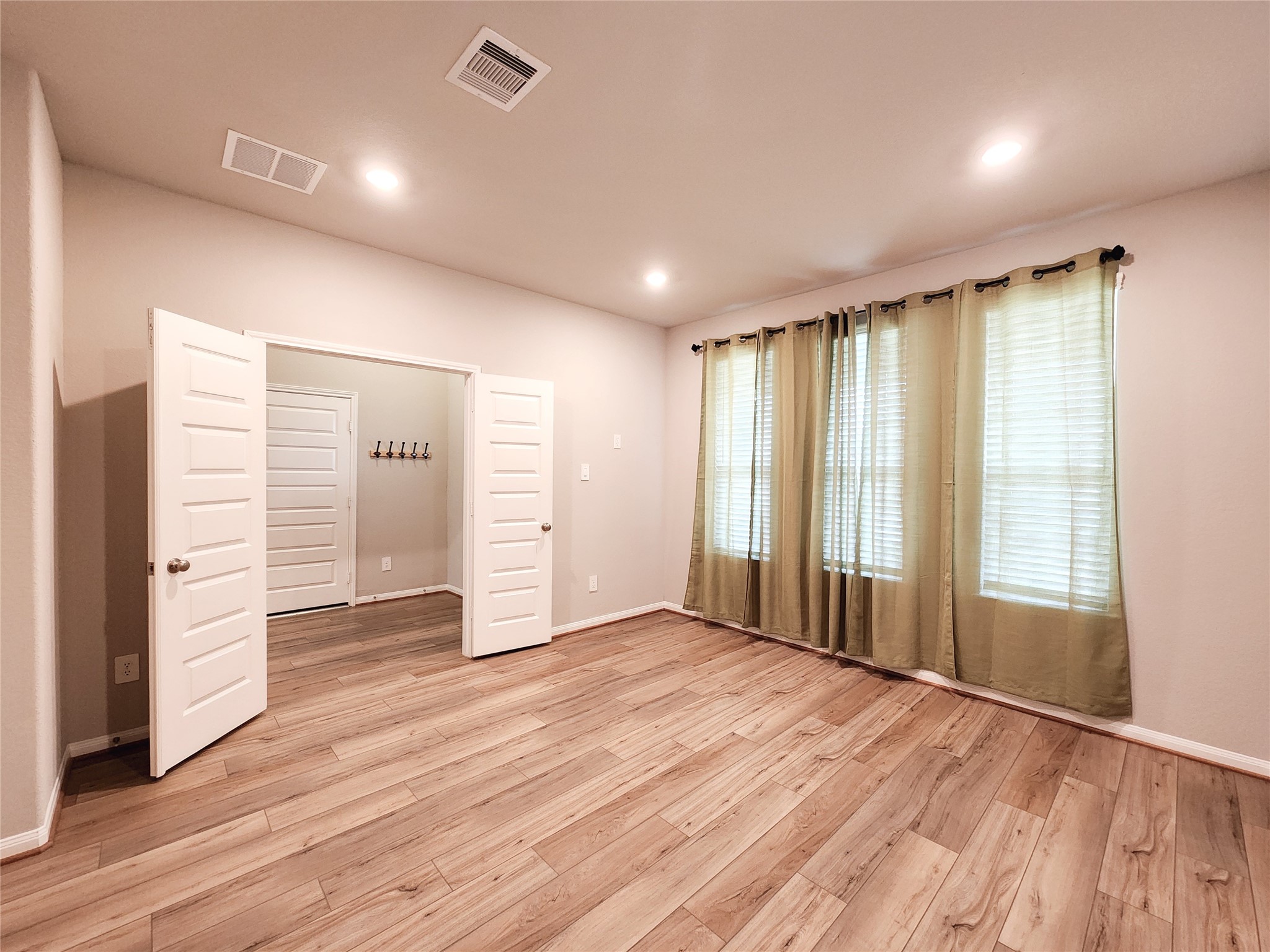 10714 Clfs Vw Drive Rosharon, TX 77583 - Photo 25 of 30 wooden floor in an empty room with a window