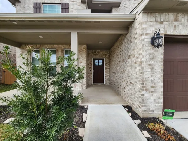 a entryway with flower pots