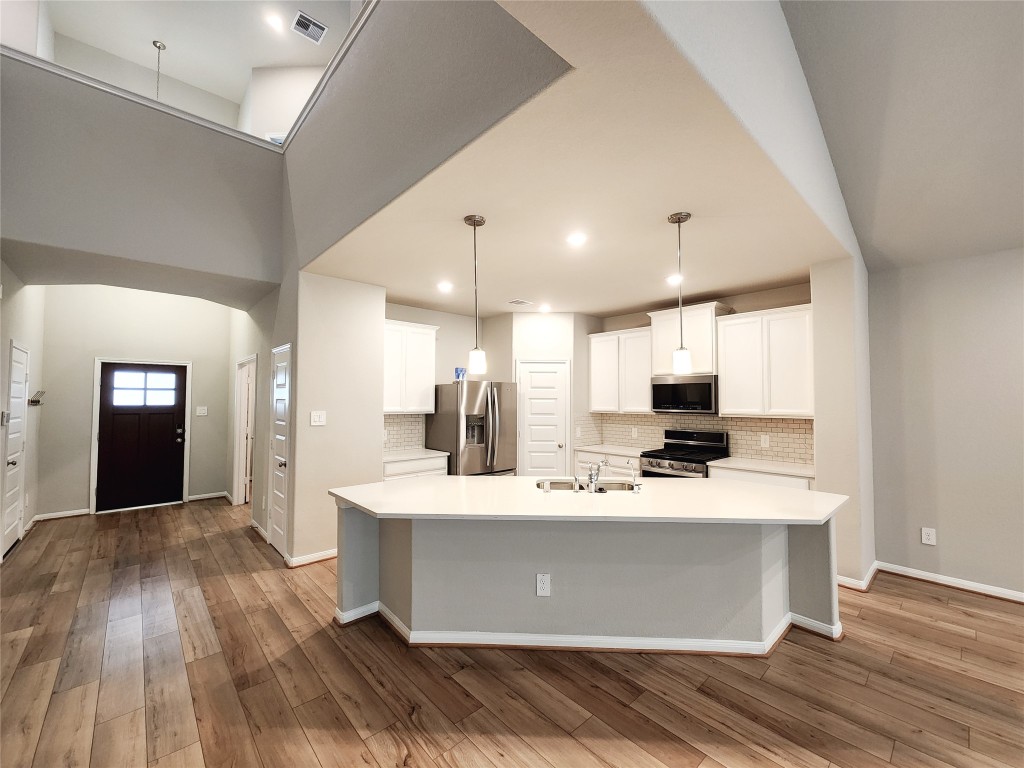 10714 Clfs Vw Drive Rosharon, TX 77583 - Photo 7 of 30 a view of kitchen with stainless steel appliances kitchen island sink and stove