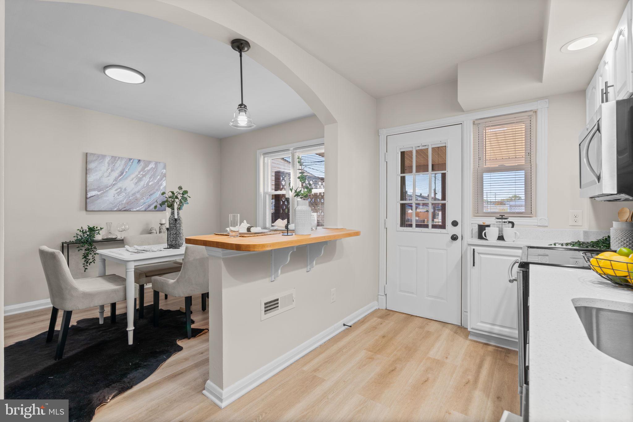 2735 Moorgate Road Dundalk, MD 21222 - Photo 12 of 35 a view of a kitchen area with furniture and window
