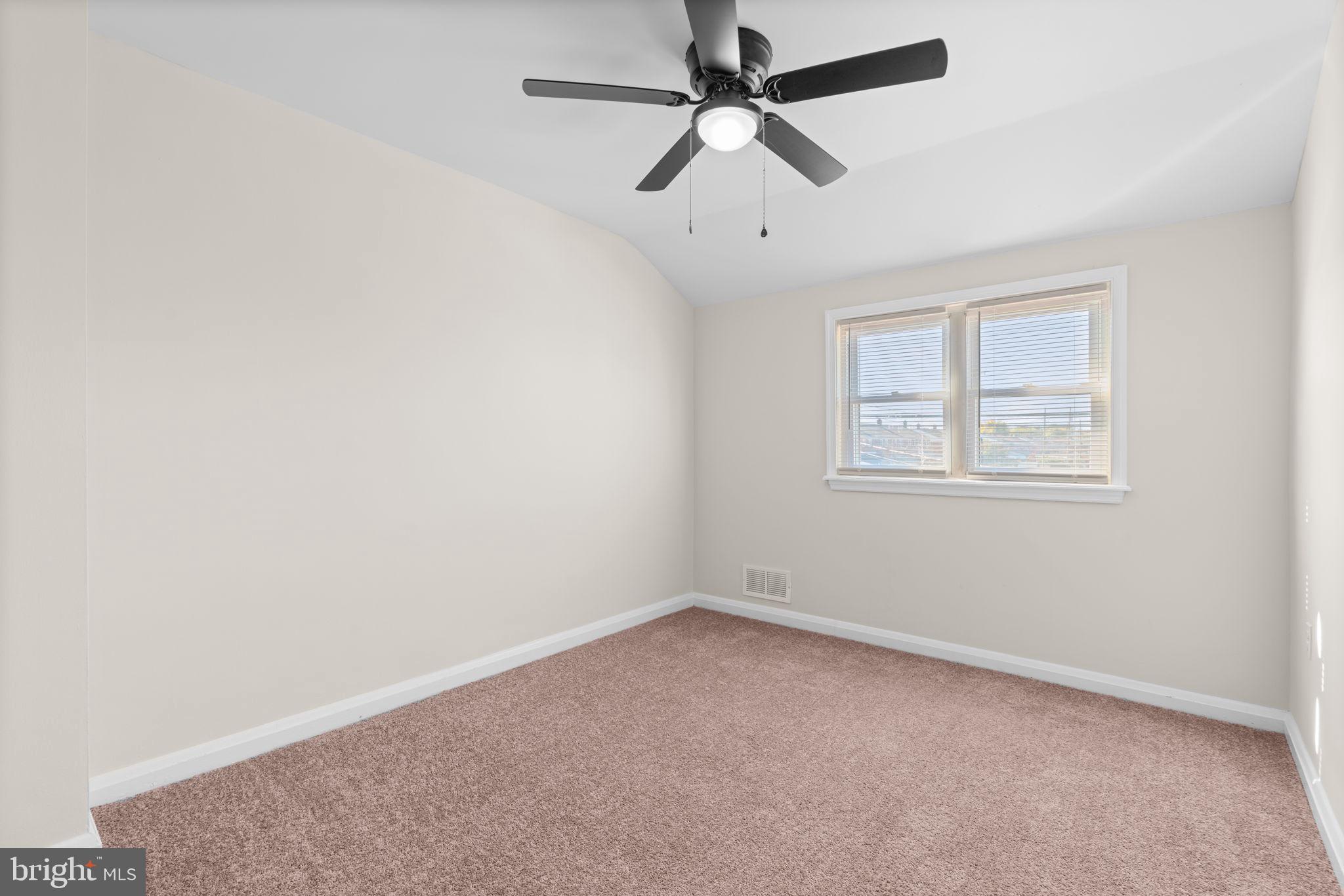 2735 Moorgate Road Dundalk, MD 21222 - Photo 18 of 35 an empty room with a window and a fan