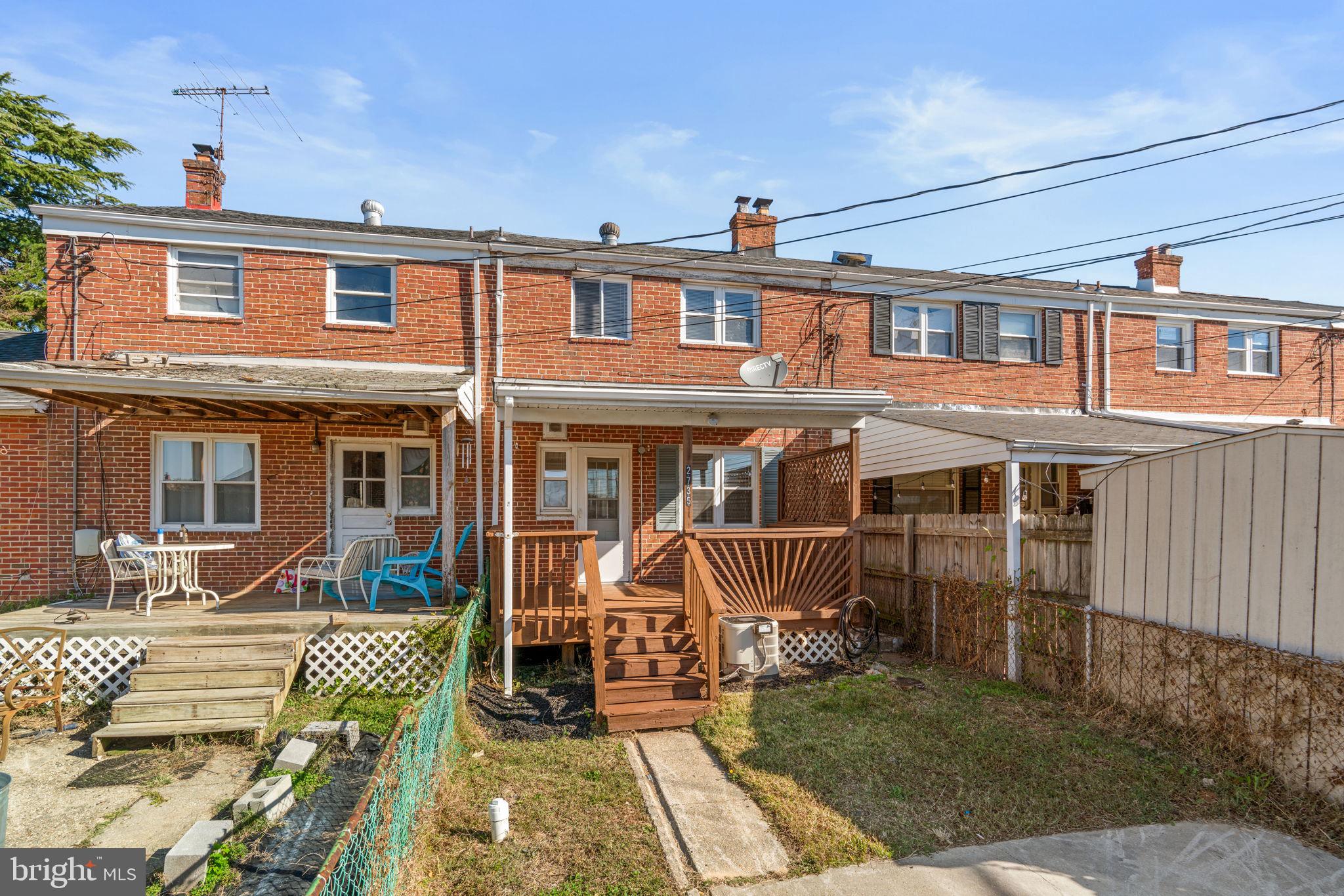 2735 Moorgate Road Dundalk, MD 21222 - Photo 33 of 35 front view of a brick house with a patio