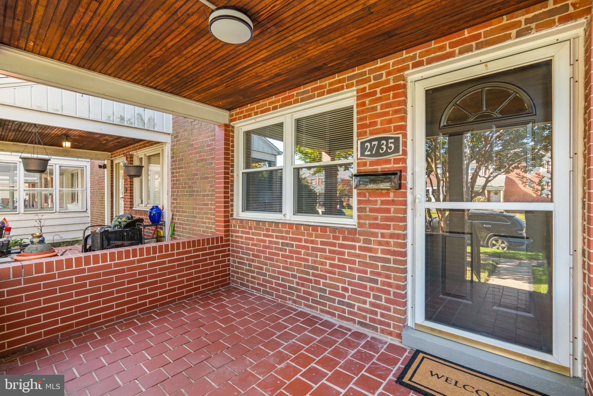 2735 Moorgate Road Dundalk, MD 21222 - Photo 4 of 35 a view of a brick house with a large window