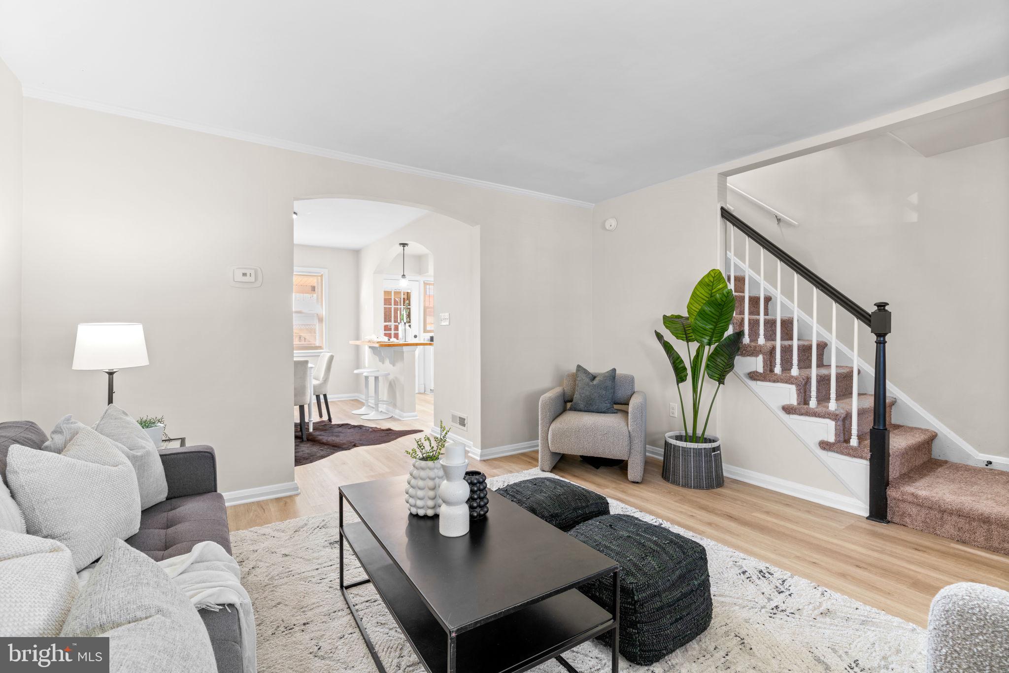 2735 Moorgate Road Dundalk, MD 21222 - Photo 6 of 35 a living room with furniture and a wooden floor
