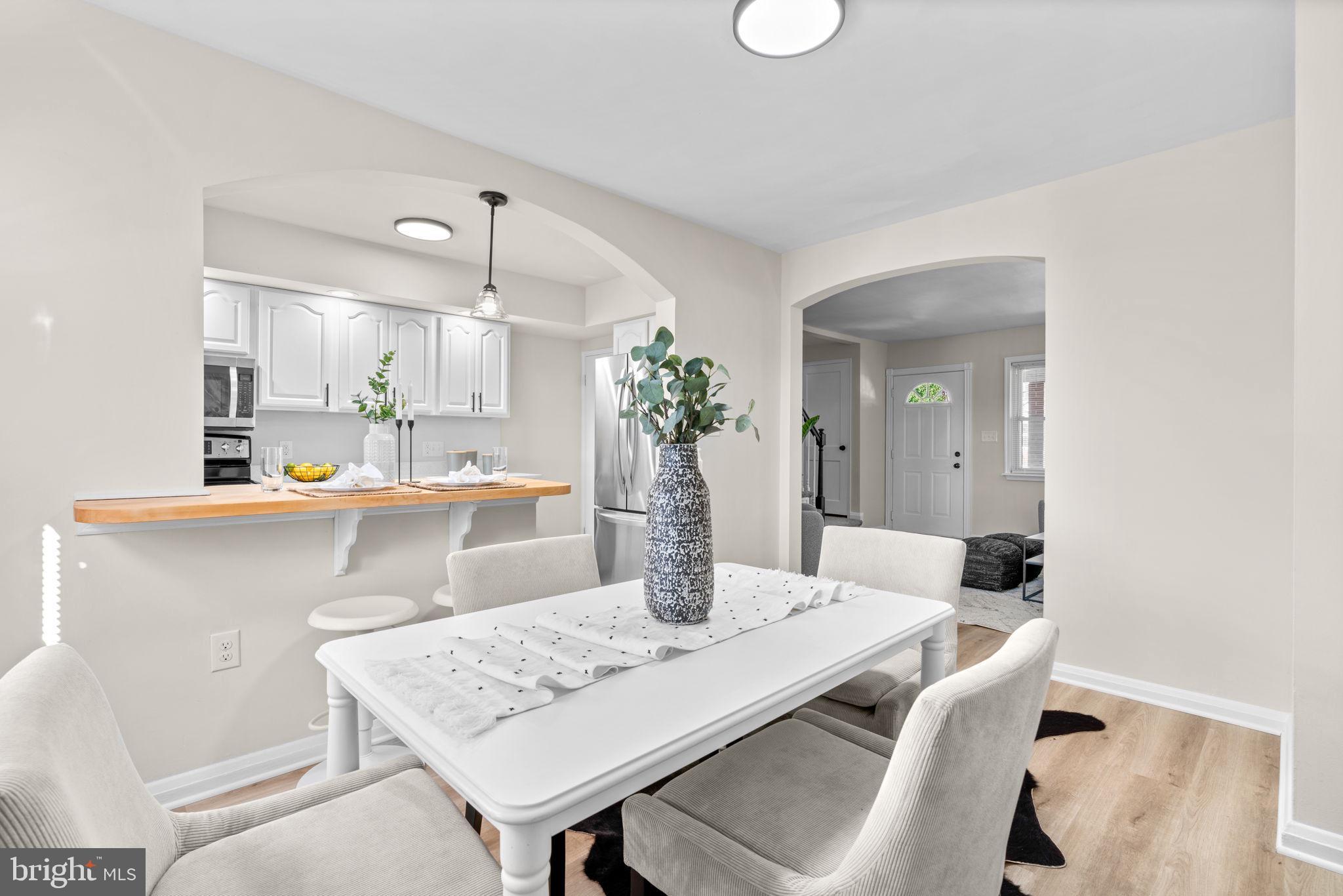 2735 Moorgate Road Dundalk, MD 21222 - Photo 10 of 35 a kitchen with a table and chairs in it
