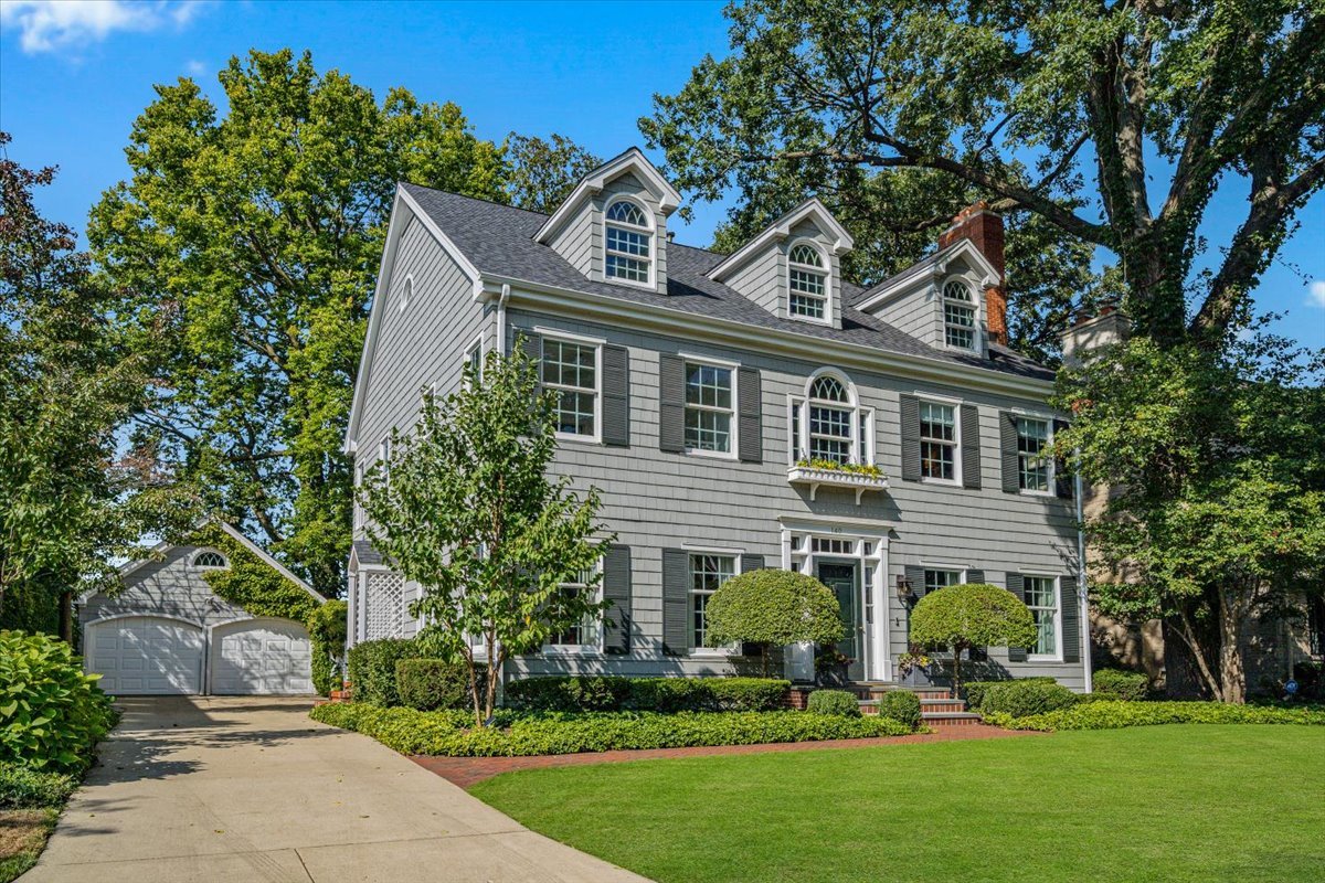 140 Fuller Lane Winnetka, IL 60093 - Photo 2 of 3 a house that has a tree in front of a house