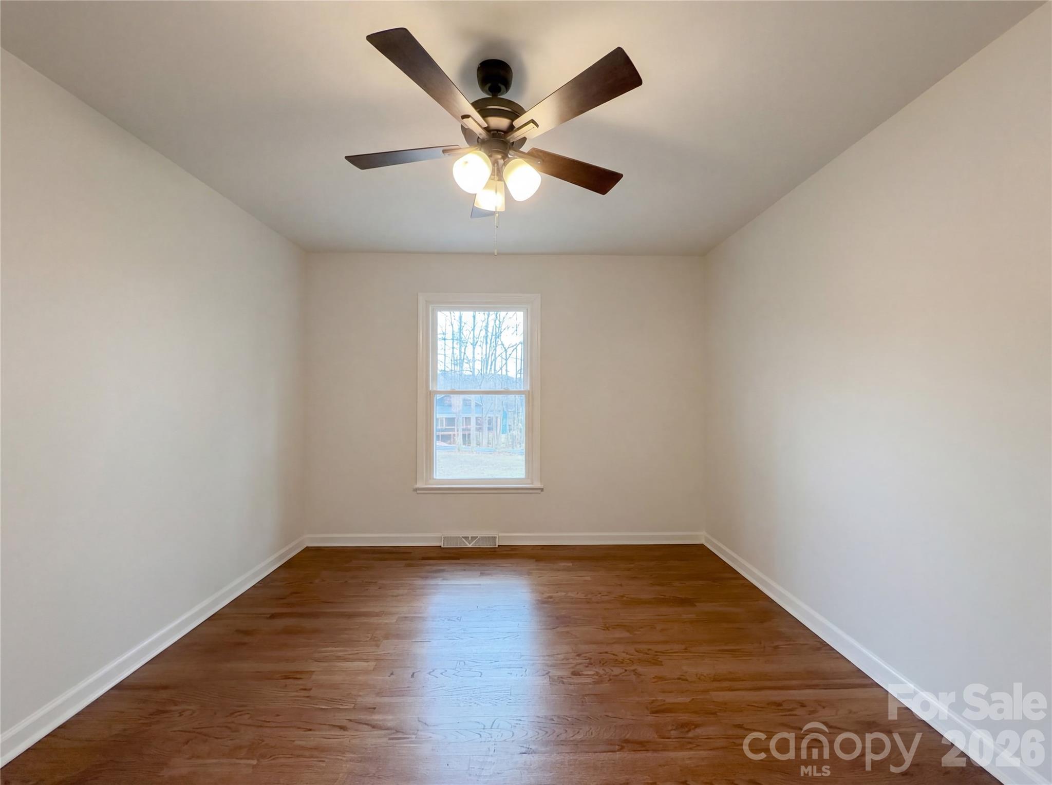 3695 Lake Shore Road South Denver, NC 28037 - Photo 15 of 16 an empty room with wooden floor and windows