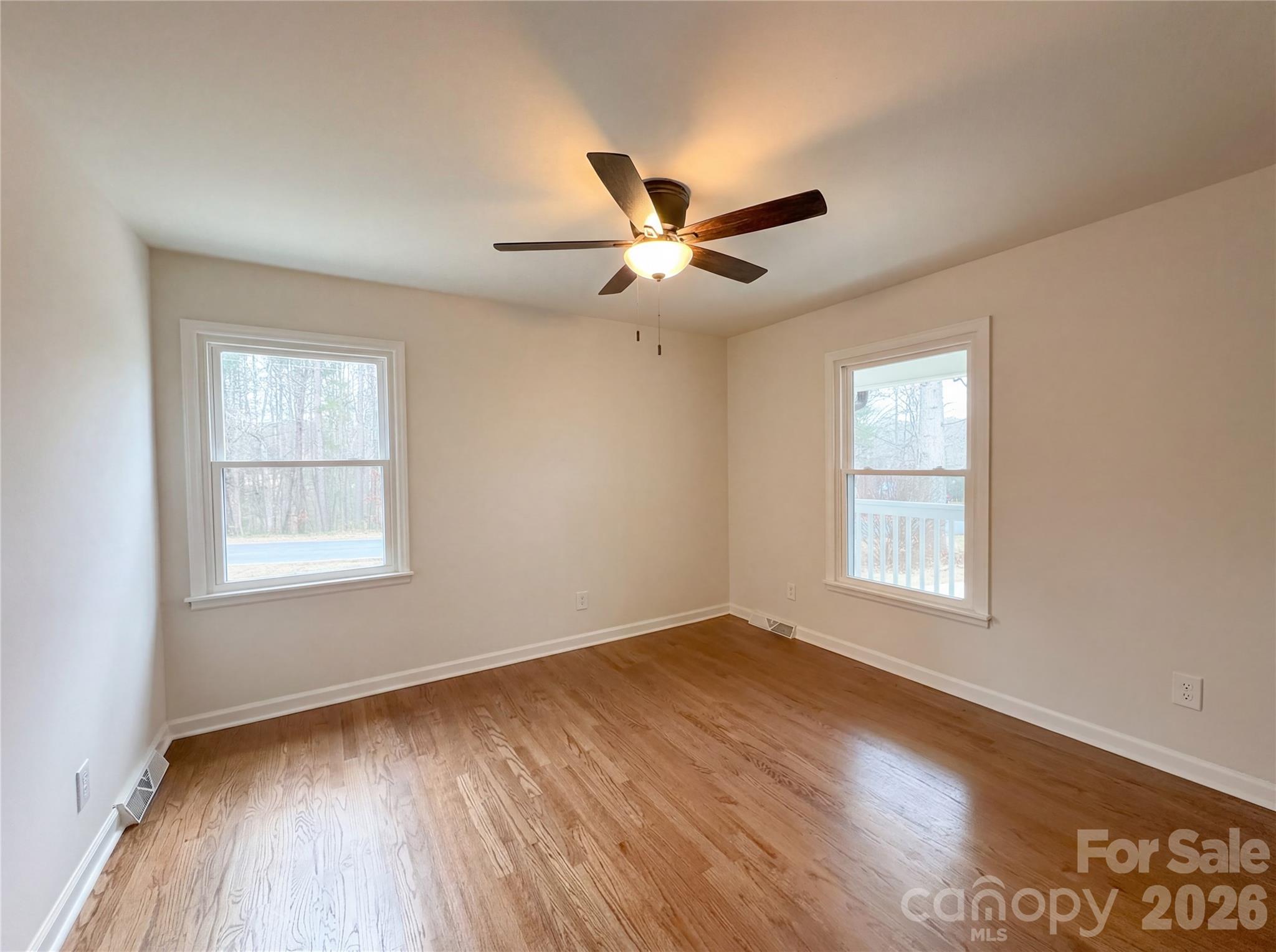 3695 Lake Shore Road South Denver, NC 28037 - Photo 9 of 16 a view of an empty room with wooden floor and a window