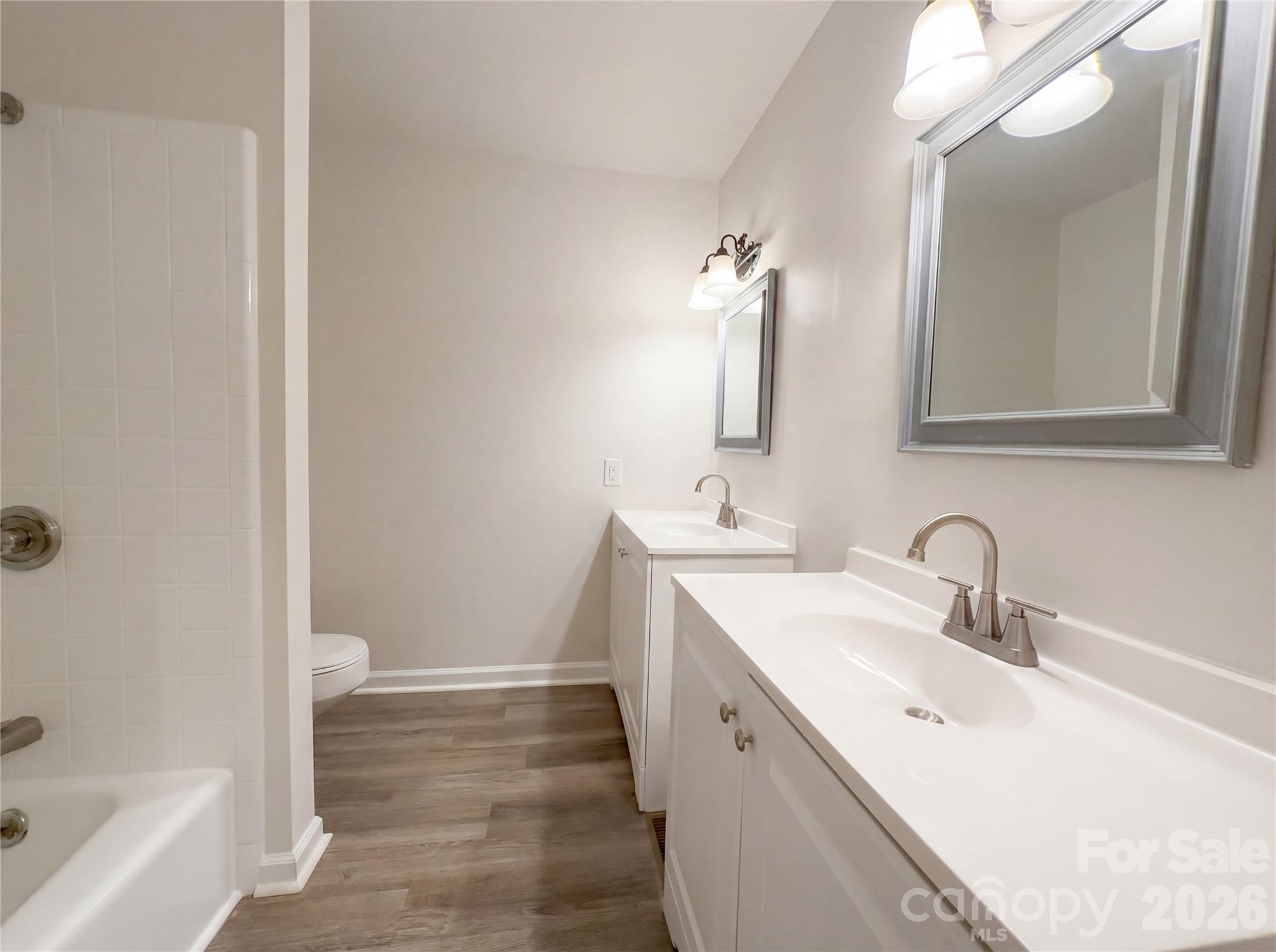 3695 Lake Shore Road South Denver, NC 28037 - Photo 10 of 16 a bathroom with a double vanity sink mirror and bathtub