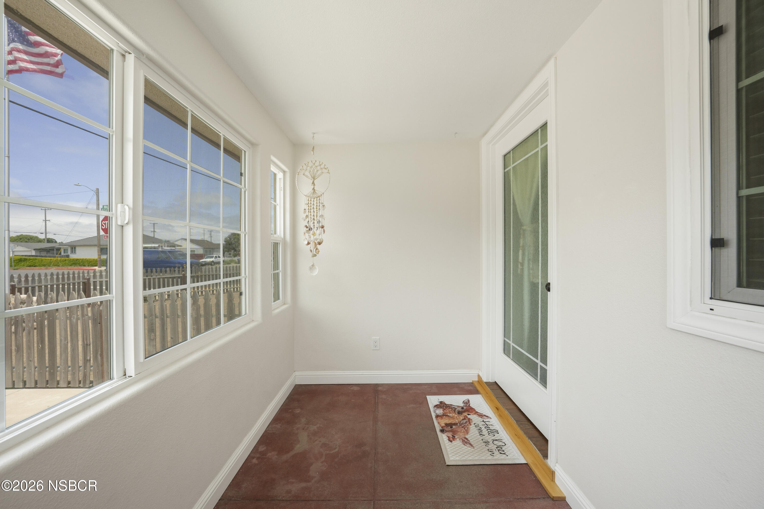 138 North E Street Lompoc, CA 93436 - Photo 6 of 35 a view of an empty room with a window