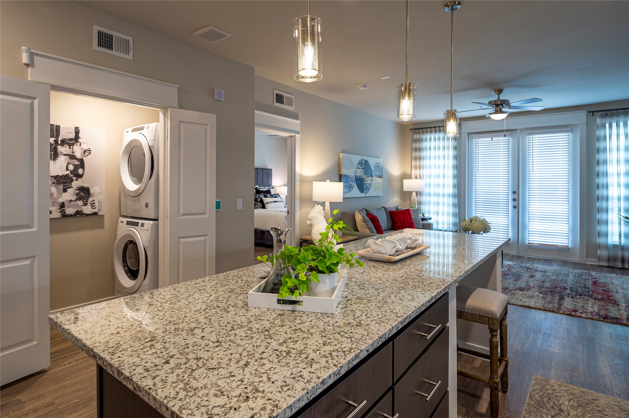 1616 Partnership Way, Unit 1220 Katy, TX 77449 - Photo 12 of 21 a kitchen with center island table and chairs