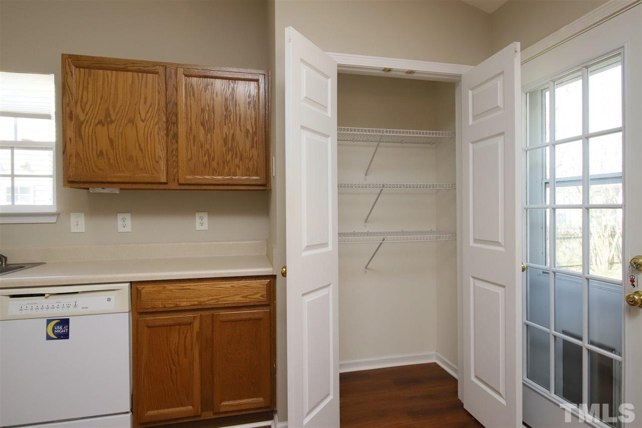 3609 Watkins Ridge Court Raleigh, NC 27616 - Photo 12 of 27 a kitchen with a sink and cabinets