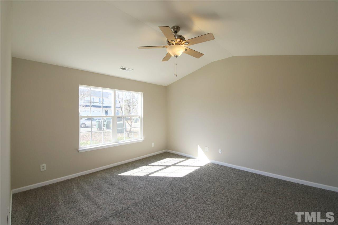 3609 Watkins Ridge Court Raleigh, NC 27616 - Photo 13 of 27 an empty room with windows and fan