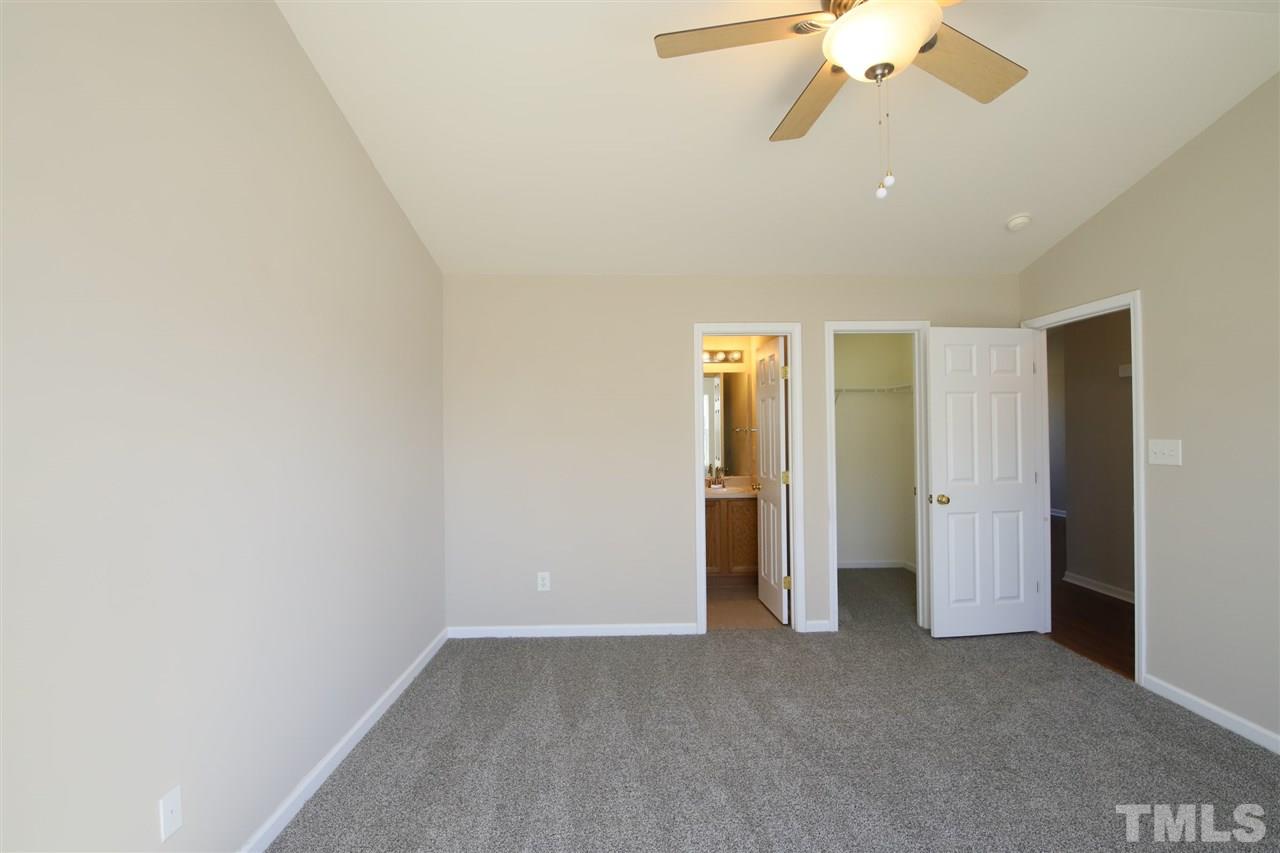 3609 Watkins Ridge Court Raleigh, NC 27616 - Photo 14 of 27 an empty room with a empty space and a ceiling fan