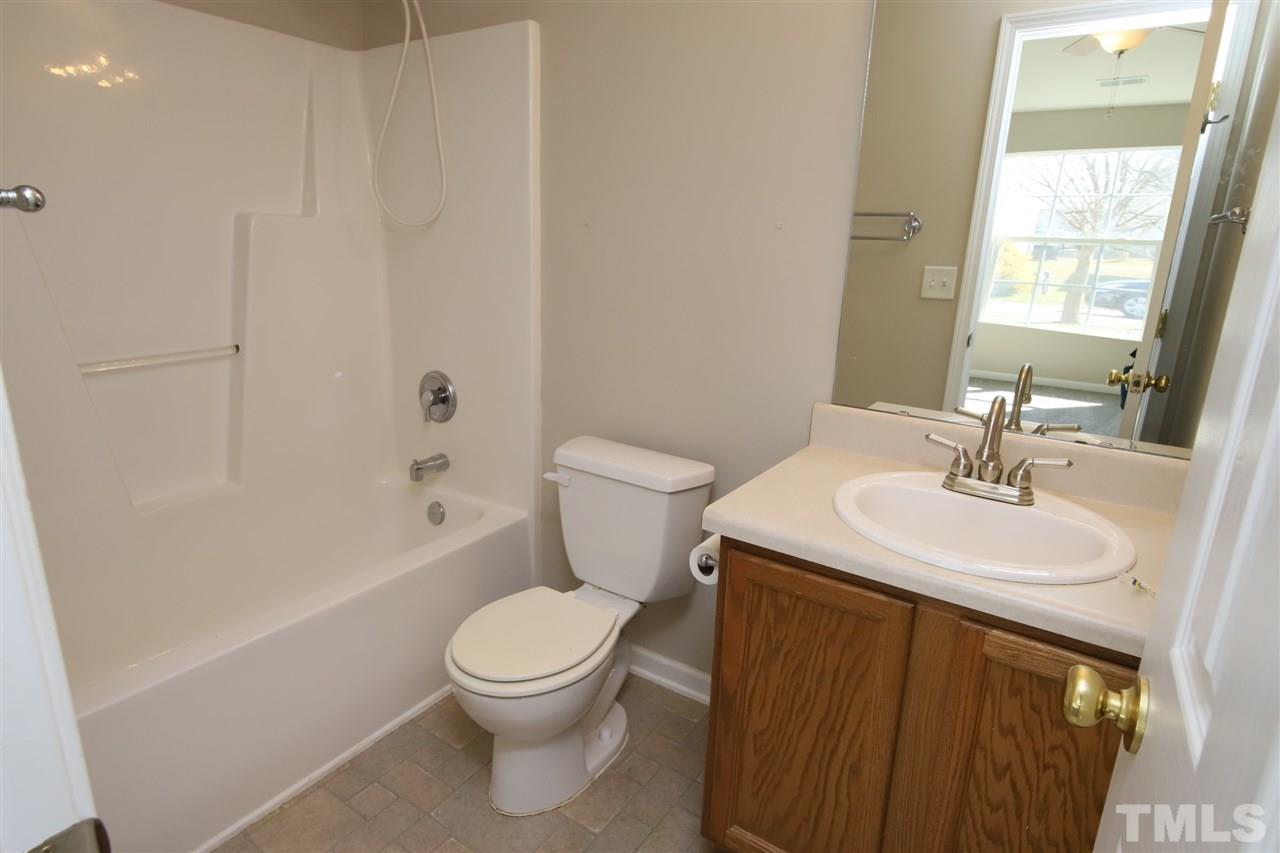 3609 Watkins Ridge Court Raleigh, NC 27616 - Photo 15 of 27 a bathroom with a sink a toilet and shower