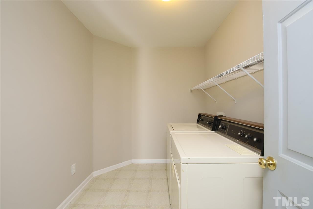3609 Watkins Ridge Court Raleigh, NC 27616 - Photo 16 of 27 a utility room with dryer and washer