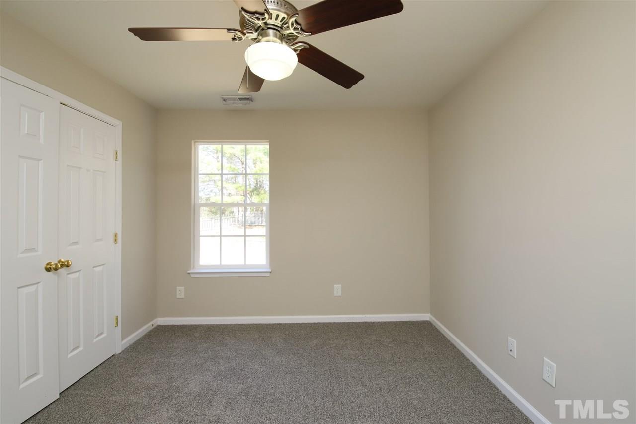 3609 Watkins Ridge Court Raleigh, NC 27616 - Photo 17 of 27 an empty room with a window and a fan