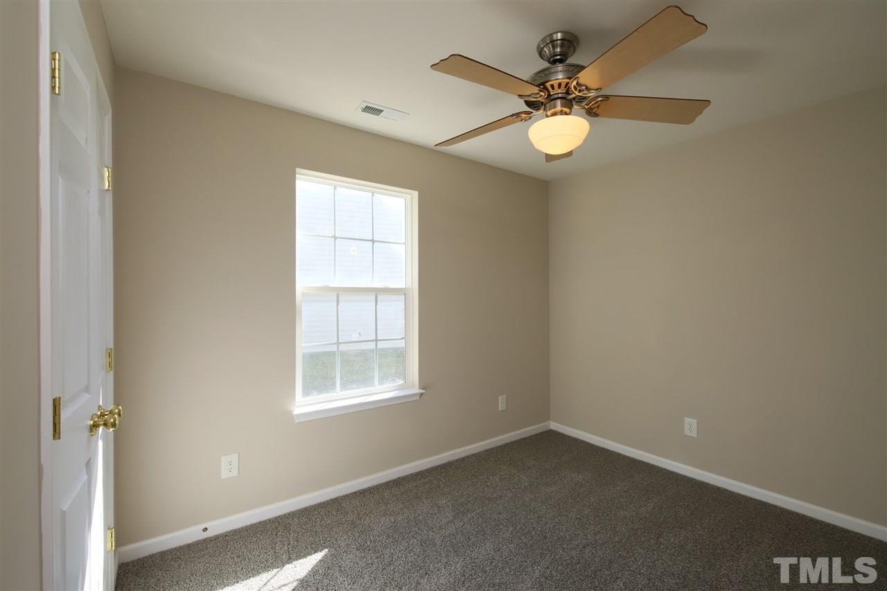 3609 Watkins Ridge Court Raleigh, NC 27616 - Photo 18 of 27 an empty room with windows and fan