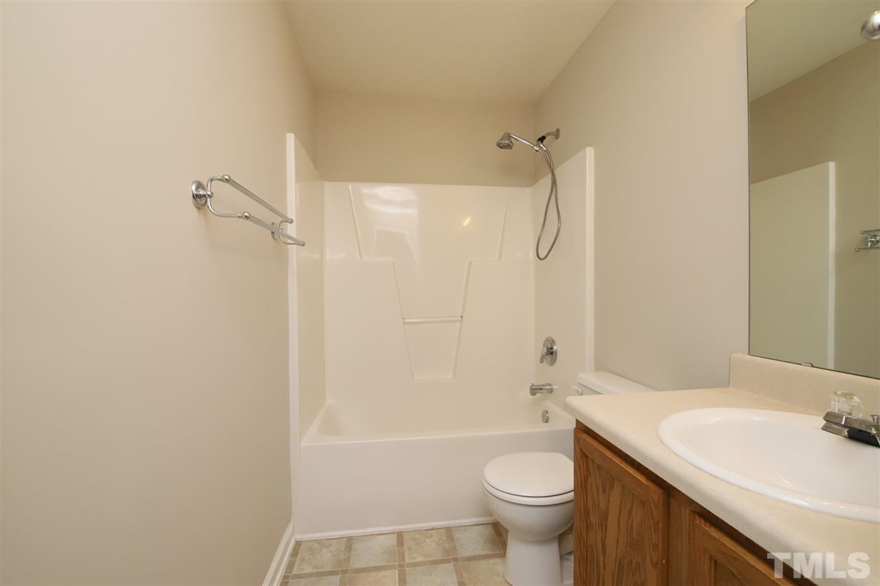 3609 Watkins Ridge Court Raleigh, NC 27616 - Photo 19 of 27 a bathroom with a sink a toilet and shower