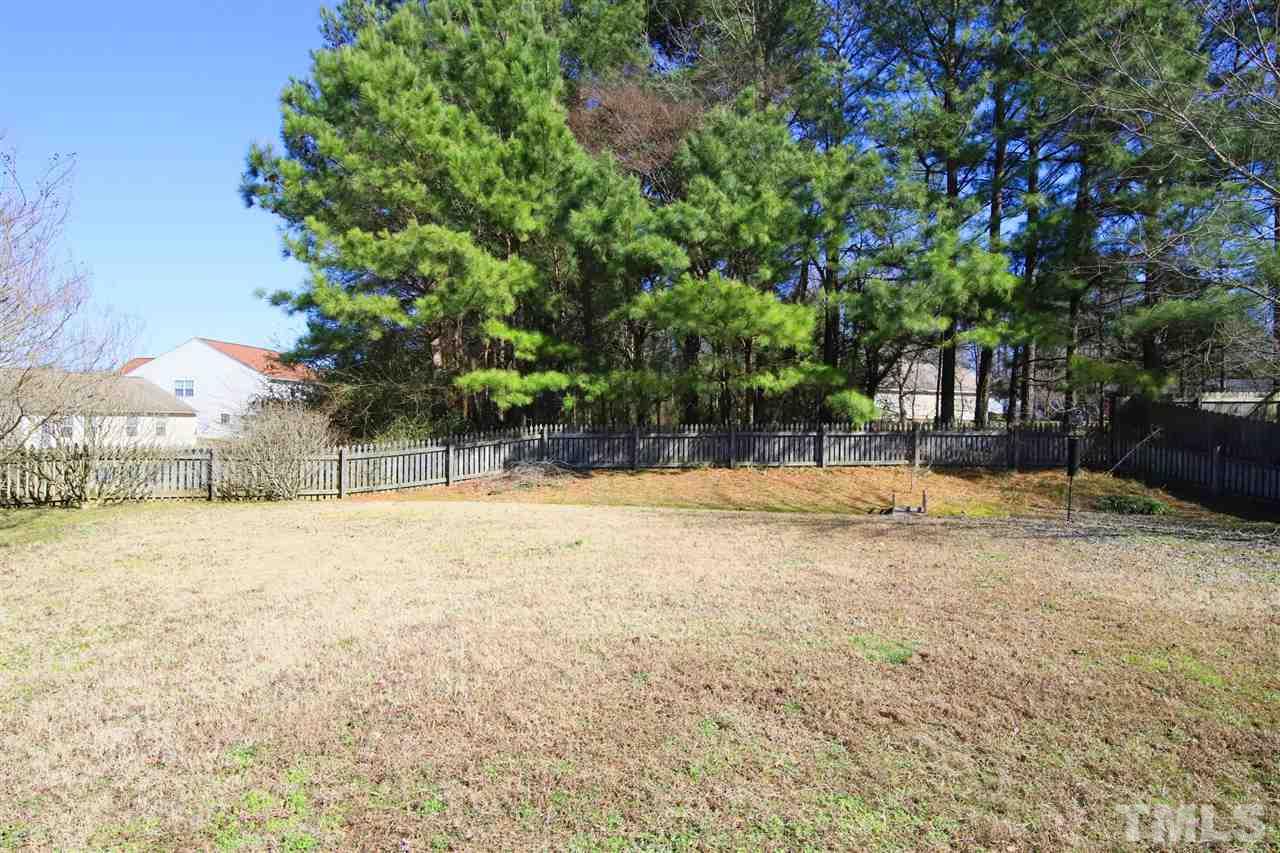 3609 Watkins Ridge Court Raleigh, NC 27616 - Photo 22 of 27 a backyard of a house with table and chairs