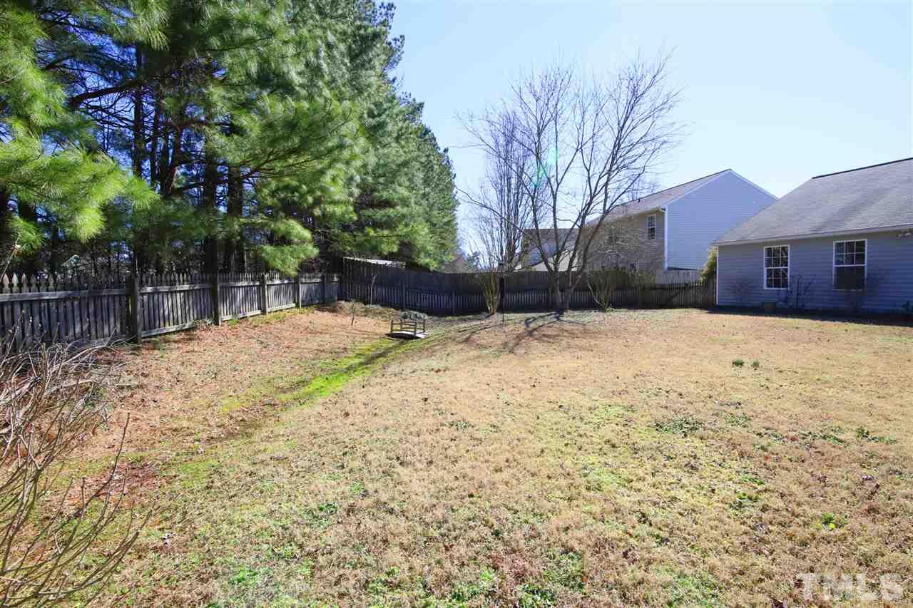 3609 Watkins Ridge Court Raleigh, NC 27616 - Photo 23 of 27 a house with trees in front of it