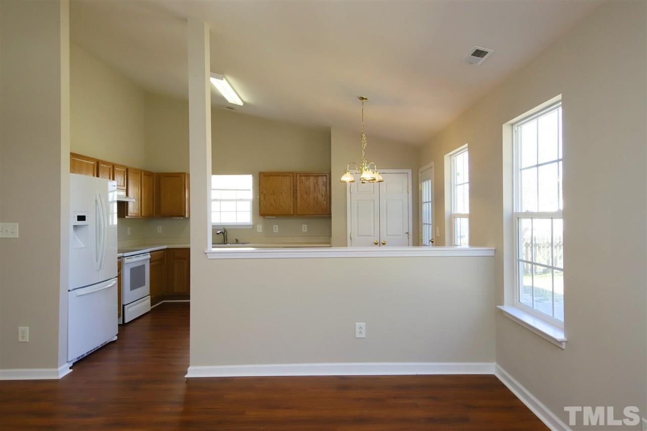 3609 Watkins Ridge Court Raleigh, NC 27616 - Photo 7 of 27 a view of a kitchen cabinets and wooden floor