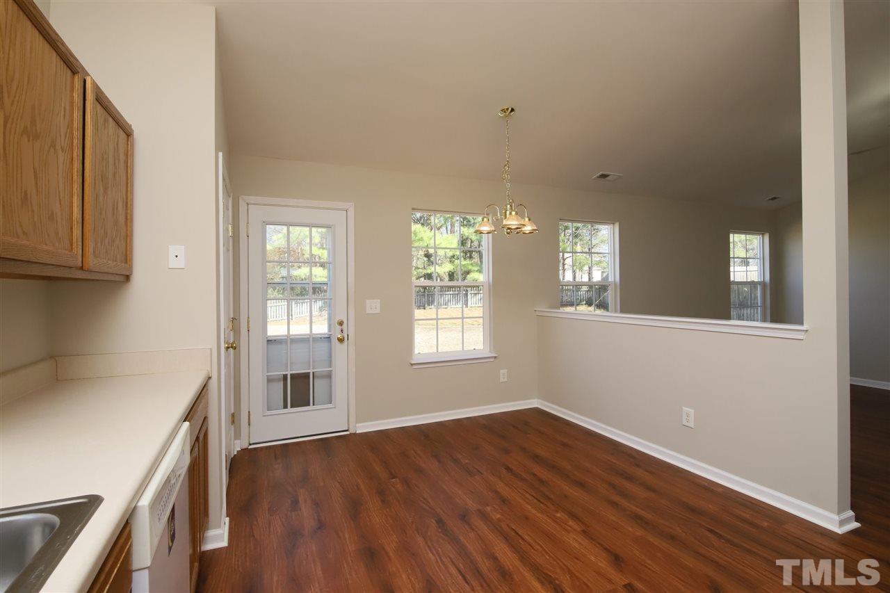3609 Watkins Ridge Court Raleigh, NC 27616 - Photo 10 of 27 a view of an empty room with wooden floor and a window