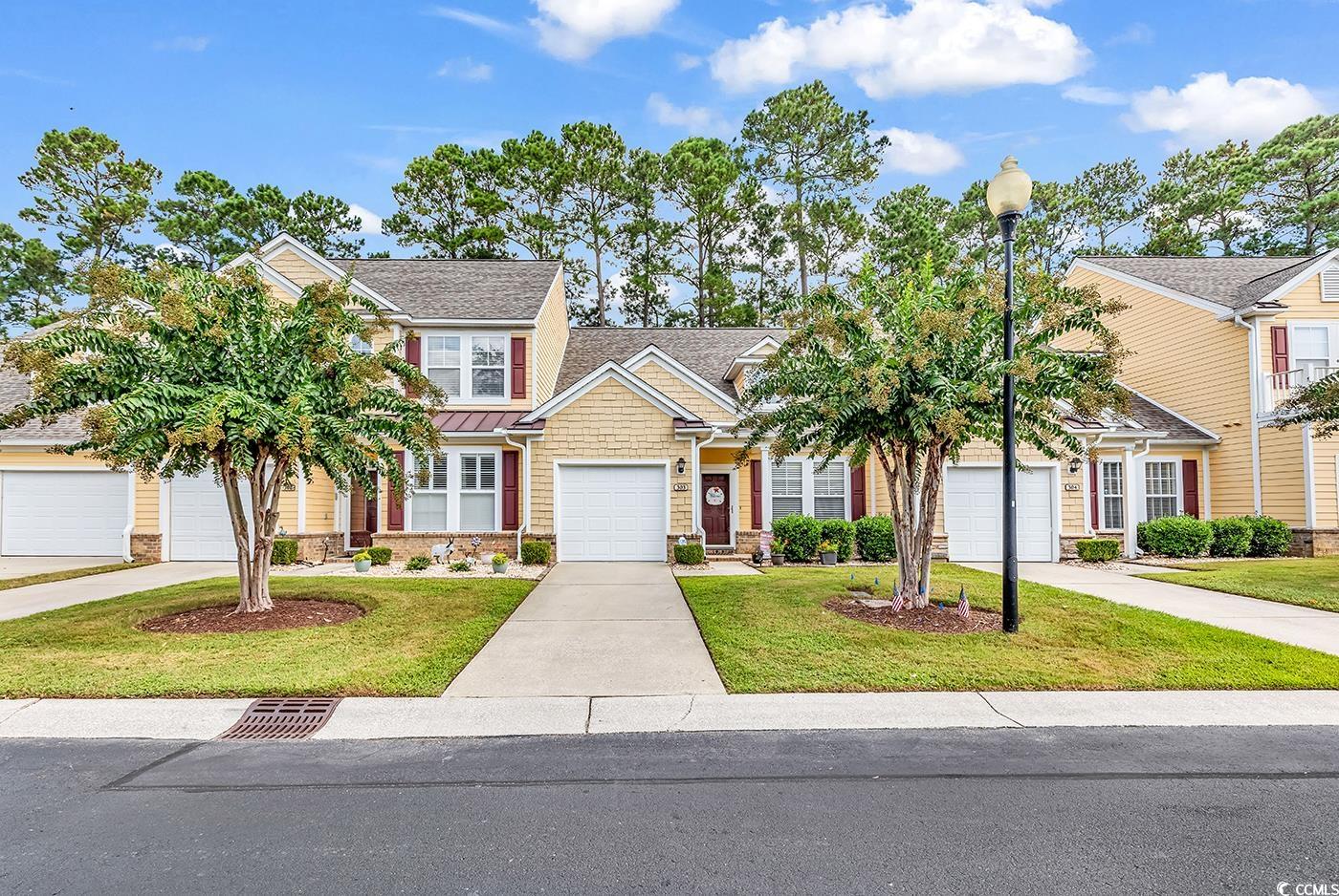112 Coldstream Cove Loop, Unit 303 Murrells Inlet, SC 29576 - Photo 1 of 39 View of front facade featuring a garage and a fron