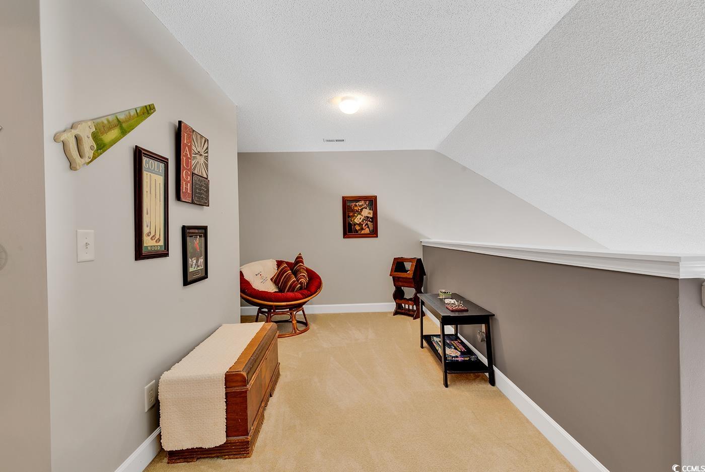 112 Coldstream Cove Loop, Unit 303 Murrells Inlet, SC 29576 - Photo 18 of 39 Interior space with light carpet, lofted ceiling,