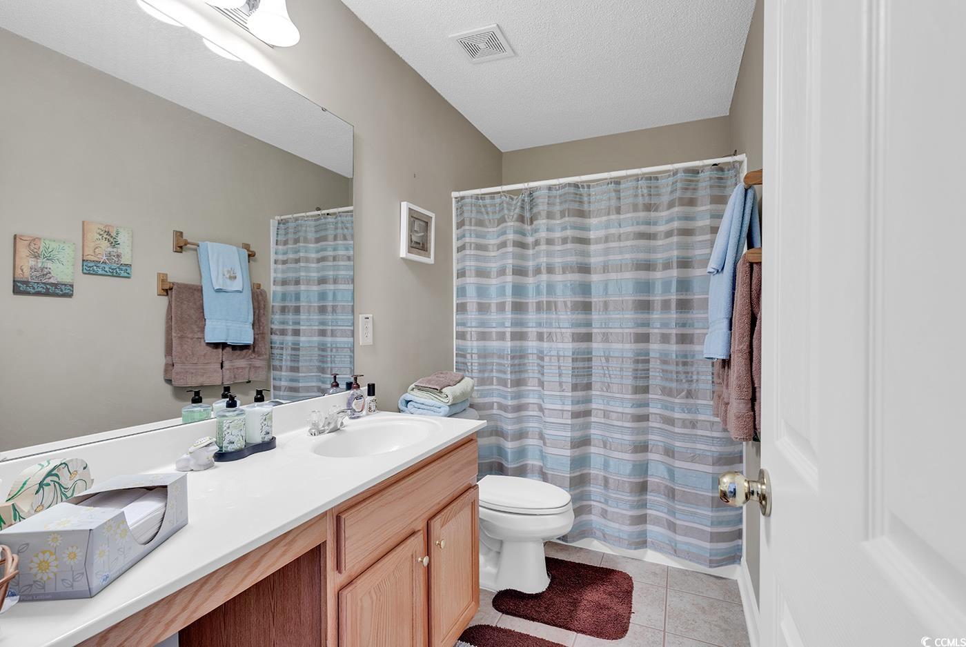 112 Coldstream Cove Loop, Unit 303 Murrells Inlet, SC 29576 - Photo 20 of 39 Bathroom featuring tile patterned floors, toilet,