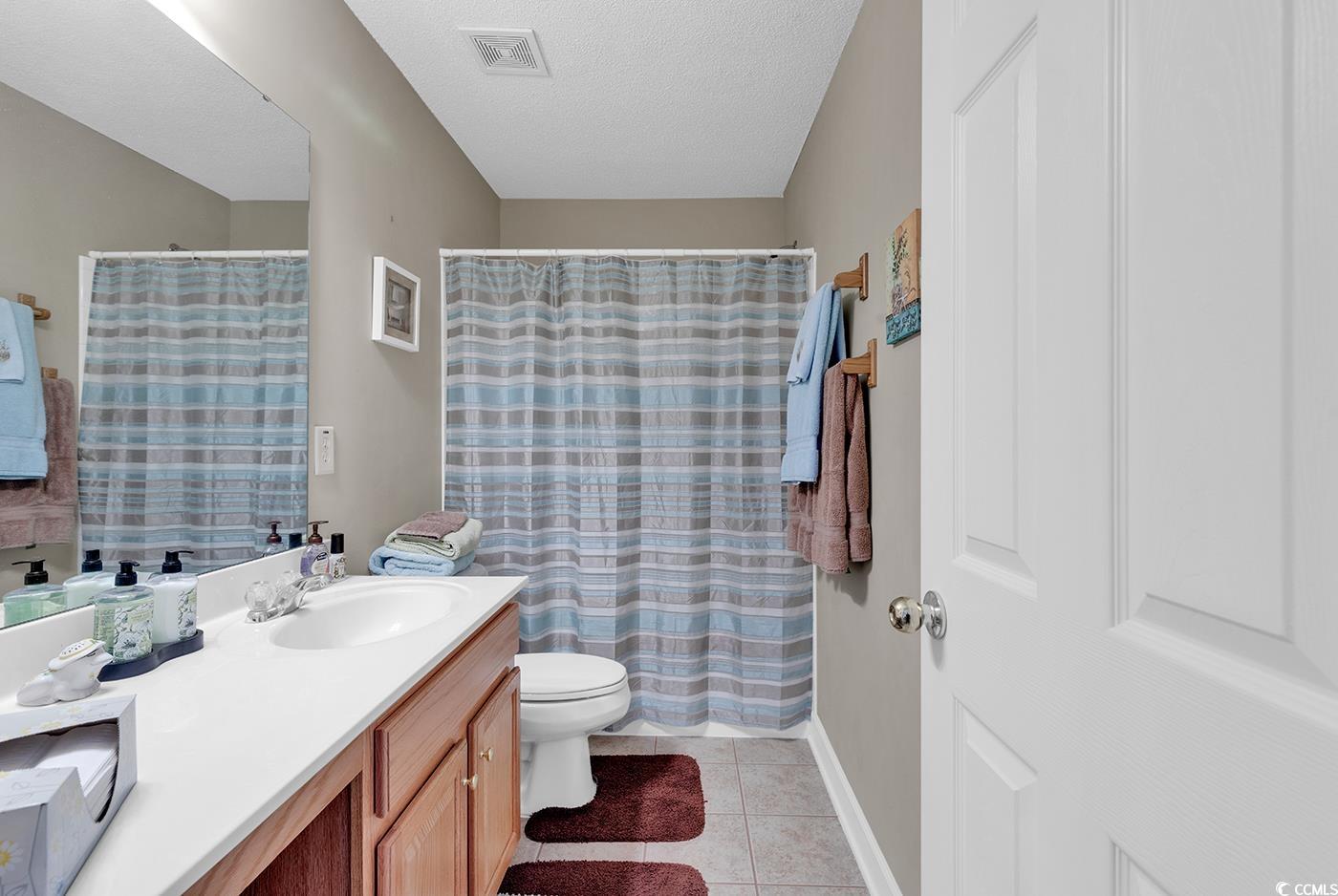 112 Coldstream Cove Loop, Unit 303 Murrells Inlet, SC 29576 - Photo 21 of 39 Bathroom featuring tile patterned floors, toilet,