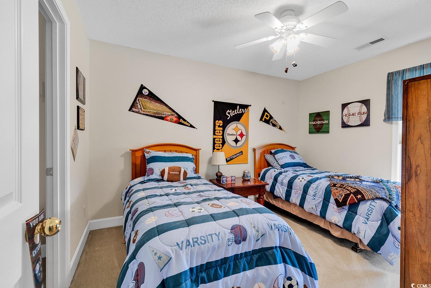 112 Coldstream Cove Loop, Unit 303 Murrells Inlet, SC 29576 - Photo 22 of 39 Carpeted bedroom with a textured ceiling and ceili