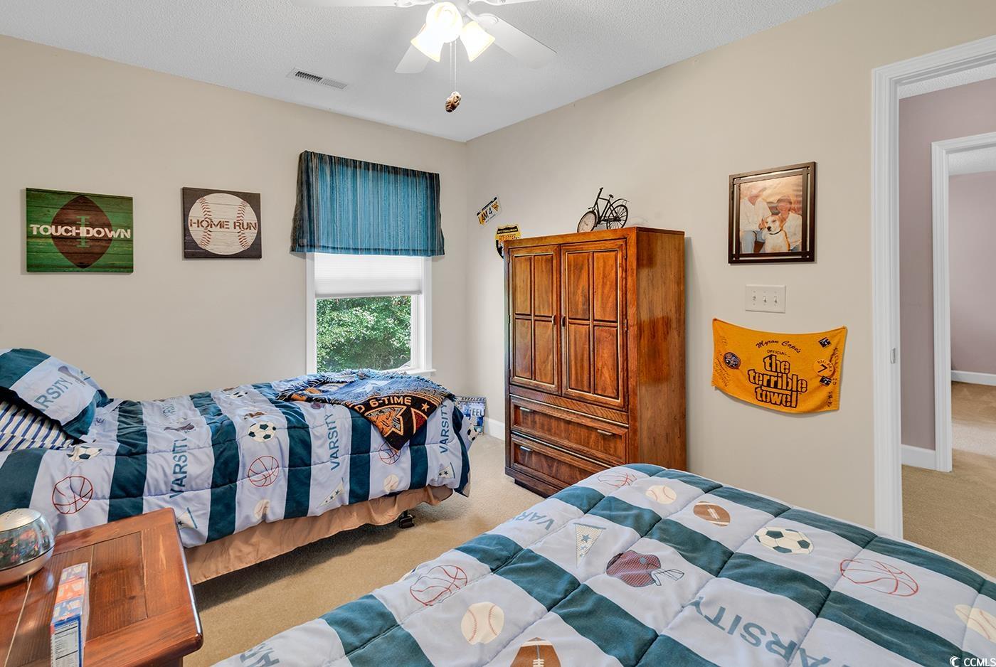 112 Coldstream Cove Loop, Unit 303 Murrells Inlet, SC 29576 - Photo 23 of 39 Bedroom with ceiling fan and light carpet