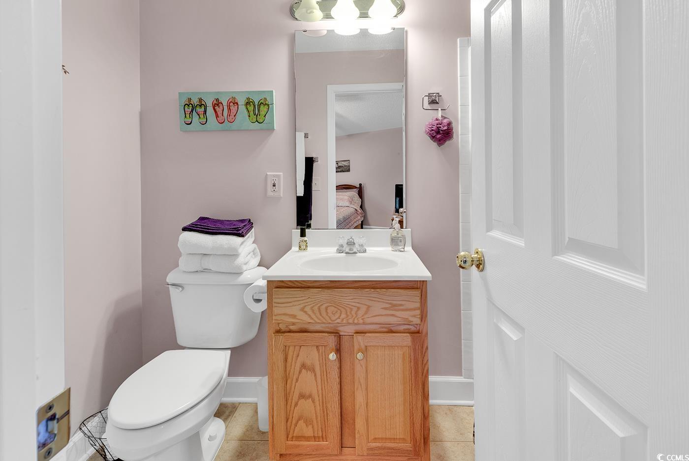 112 Coldstream Cove Loop, Unit 303 Murrells Inlet, SC 29576 - Photo 28 of 39 Bathroom with vanity, toilet, and tile patterned f