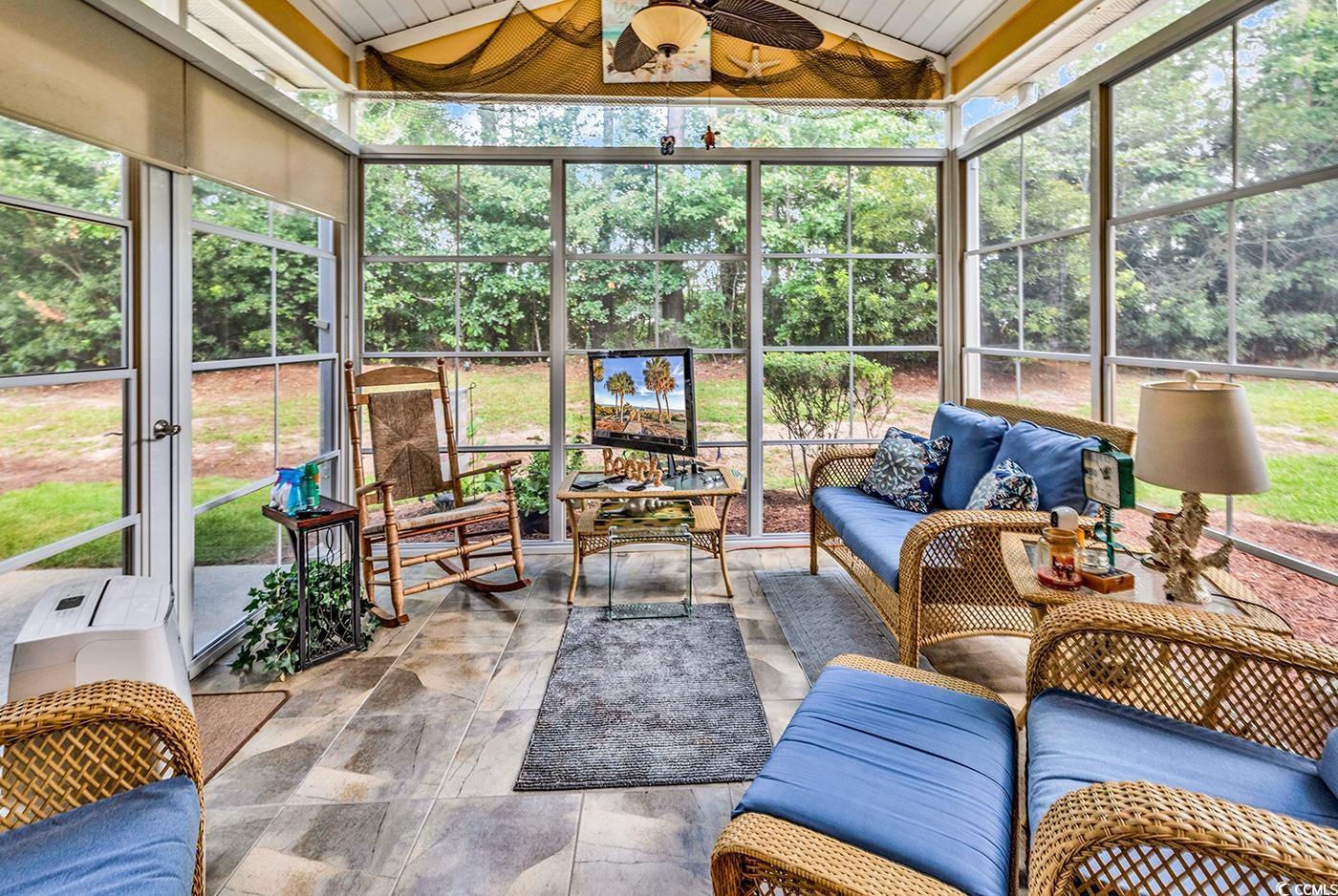 112 Coldstream Cove Loop, Unit 303 Murrells Inlet, SC 29576 - Photo 32 of 39 Sunroom / solarium featuring lofted ceiling, ceili